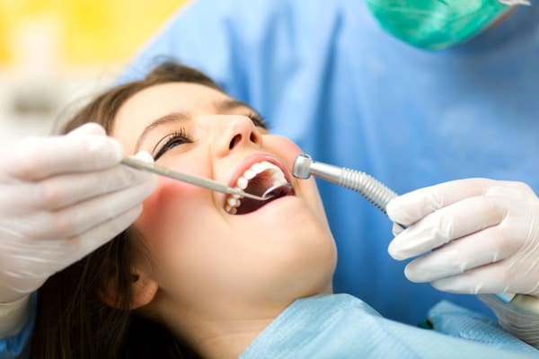 scaling polishing teeth cleaning singapore dentist